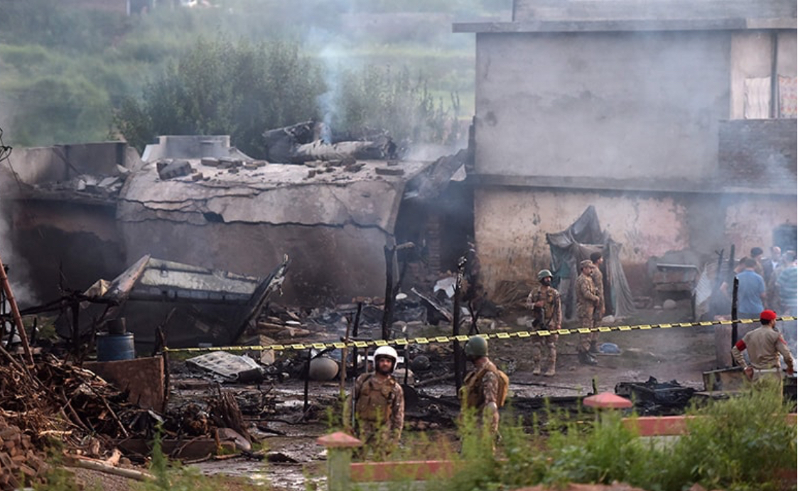 the scene of the plane crash in Pakistan
