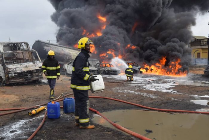 Fire fighters battling the fire triggered by oil pipeline vandalism