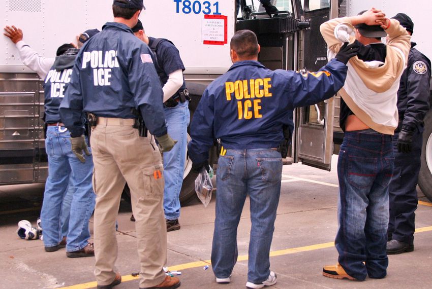 Immigration and Customs Enforcement(ICE) with some arrested immigrants in their office