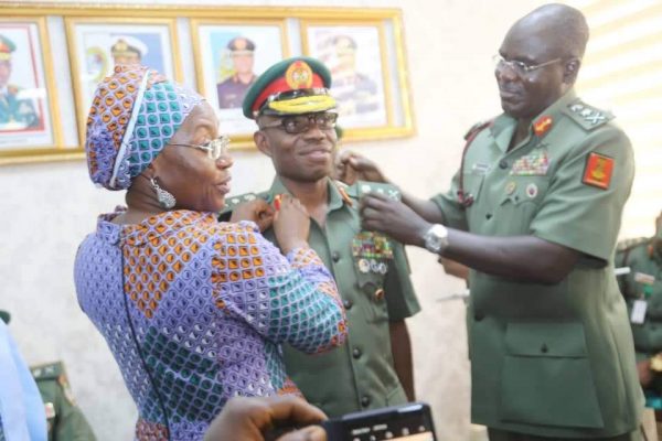 Lt. general L.O Adeosun being decorated with his new rank by