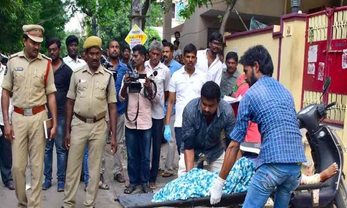 Beheaded woman being carried away in Hyderabad on Sunday