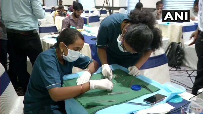 Doctors do a physical count of the teeth removed from the jaw of the seven year-old boy