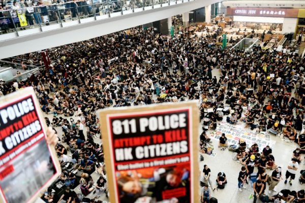 Protesters in black stop operations at Hong Kong airport