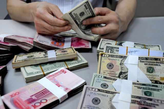 US Treasury Department accuses China of being a currency manipulator. Above, the Chinese Yuan and US dollar