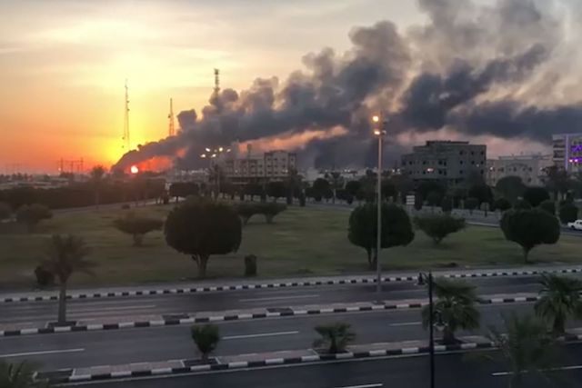The Saudi oil facility in Abqaiq burns after the drone attack
