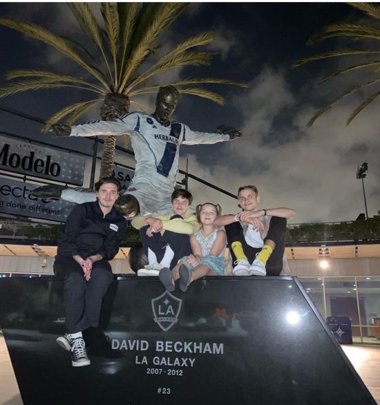 Beckham’s children at the base of his statue at LA Galaxy