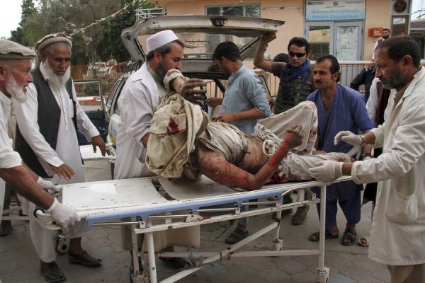 A wounded victim being stretchered out from the mosque in Haskamena district of Jalalabad east of Kabul, Afghanistan