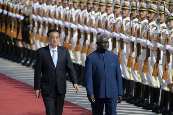 Solomon Islands Prime Minister Manasseh Sogavare, right, during a recent visit to China