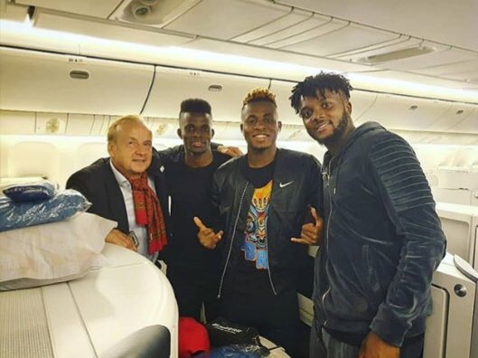 Super Eagles players with Gernot Rohr inside the plane