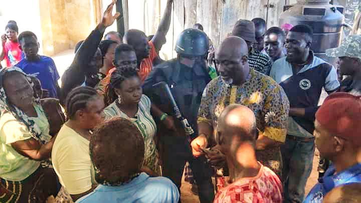 Dino Melaye sharing money at polling booth on Saturday