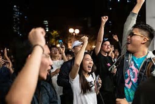Hong Kong pro-democracy activists celebrate poll victory