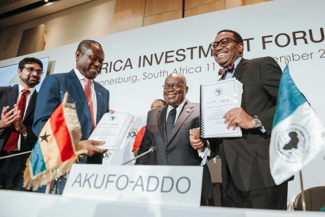 President Nana Akufo-Addo, centre, with AfDB President Akinwumi Adesina at the signing ceremony in Johannesburg