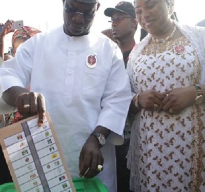 Yahaya Bello and wife cast their ballots in Okene