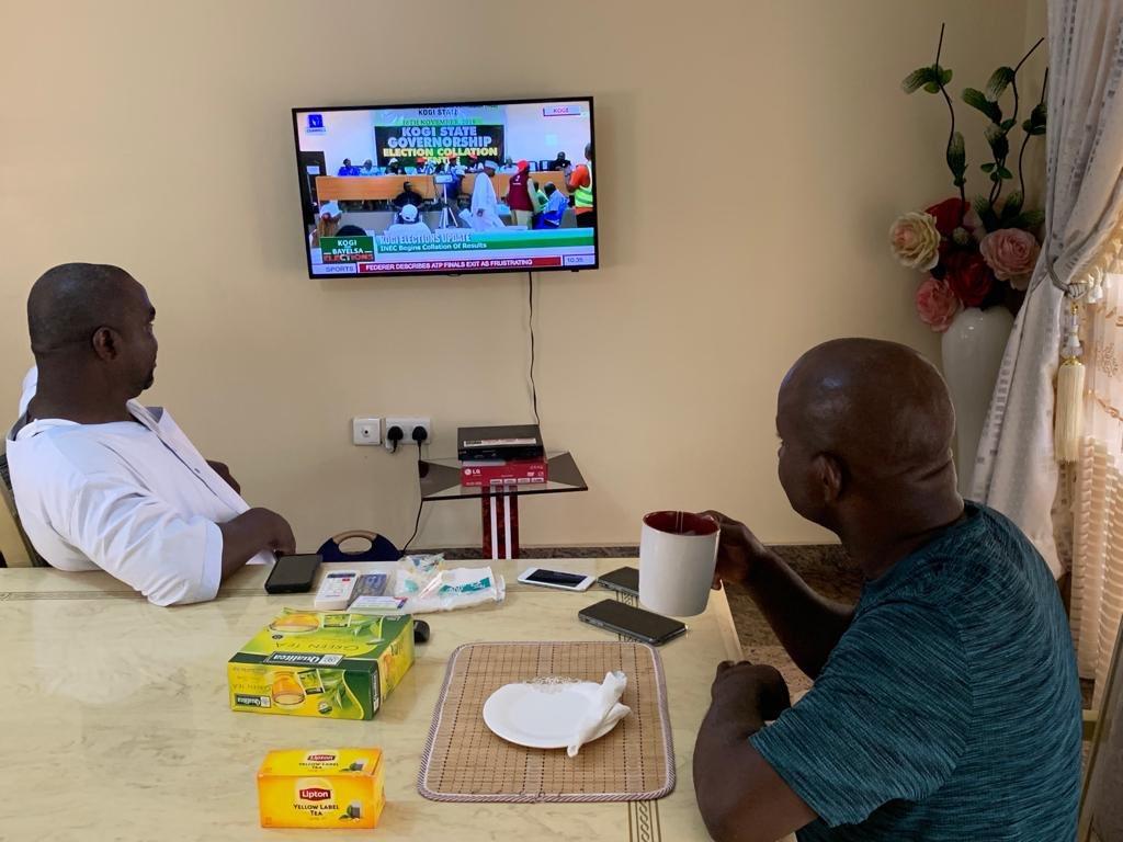 Yahaya Bello sips tea as he watches live broadcast of governorship election results