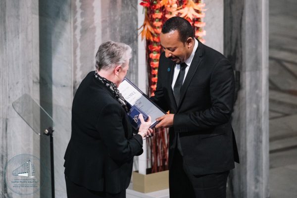 Abiy Ahmed right, receives his Nobel Peace Prize