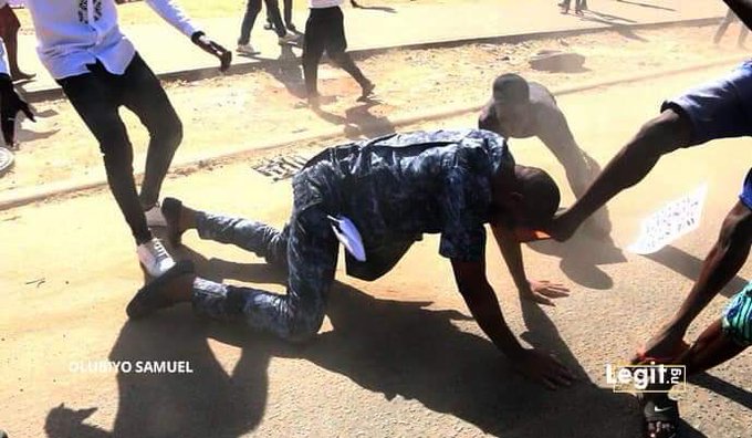 Deji Adeyanju being kicked by hoodlums in Abuja on Monday