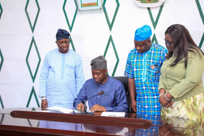 Governor Seyi Makinde signing Oyo State Financial Crimes Commission Bill into law