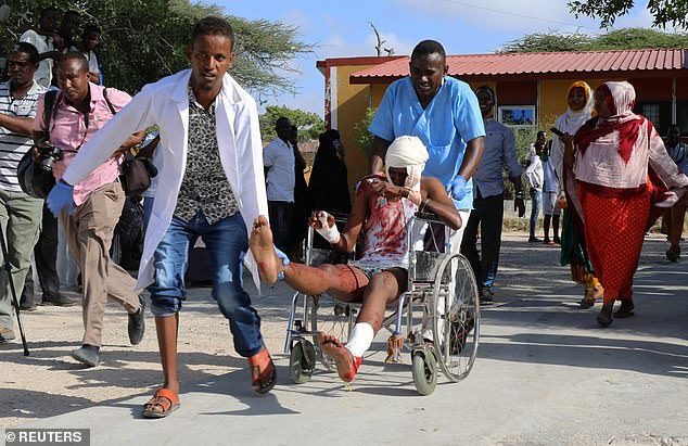 One of the victims of the rush hour car bombing in Mogadishu on arrival at a hospital