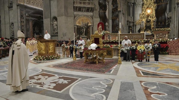 Pope Francis, left at the Christmas Night mass