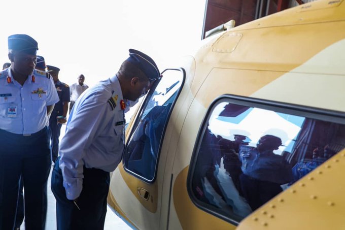 Air Force chief Abubakar Sadique peeps into one of the Agusta helicopters