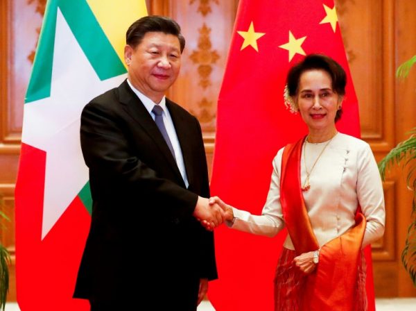 Chinese leader Xi Jinping in Myanmar with Aug San Suu Kyi. But the visit marred by Facebook horrendous translation of his name