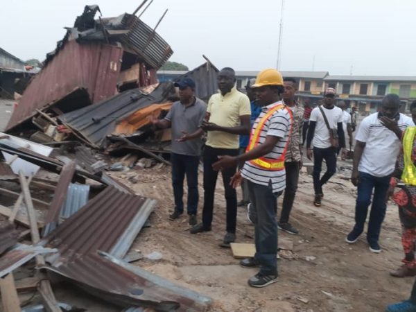 Cross-River-State-Commissioner-for-Environment-Mr-Mfon-Bassey-right-during-the-demolition-exercise-e1579423182684