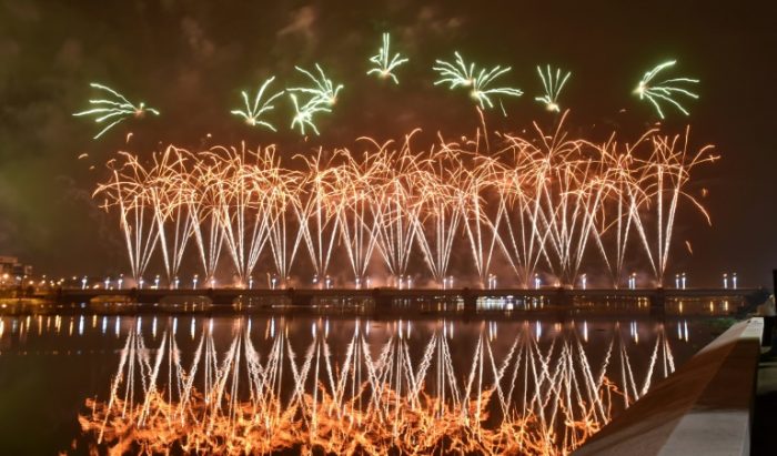 Fireworks light up the sky over the General de Gaulle bridge and the Ebrie lagoon Abidjan
