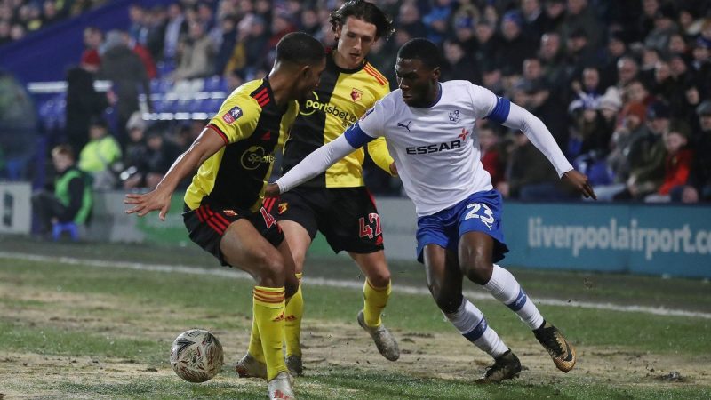 Tranmere Rovers player, right, tries to break through Watford wall