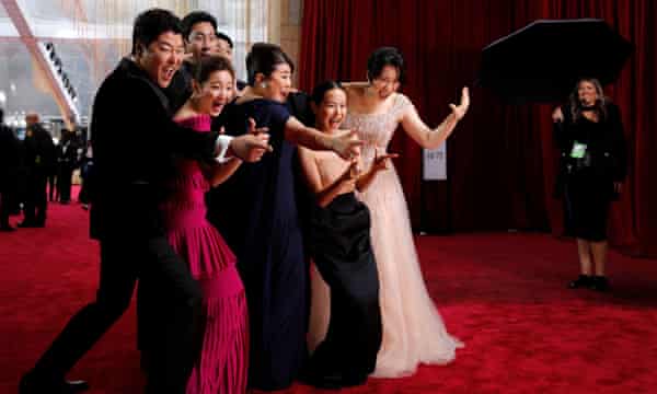 The cast of Parasite pose on the red carpet at the 92nd Academy Awards in Hollywood, Los Angeles.
