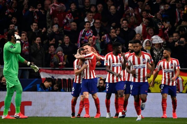 Atletico’s Saul Niguez , 2nd left, celebrates goal against Liverpool