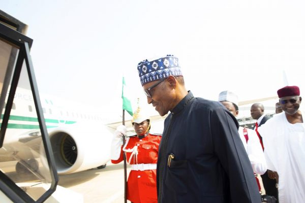 Buhari moves to board his flight to Addis Ababa
