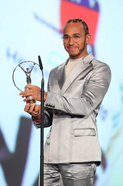 Lewis Hamilton with the award he shares with Lionel Messi
