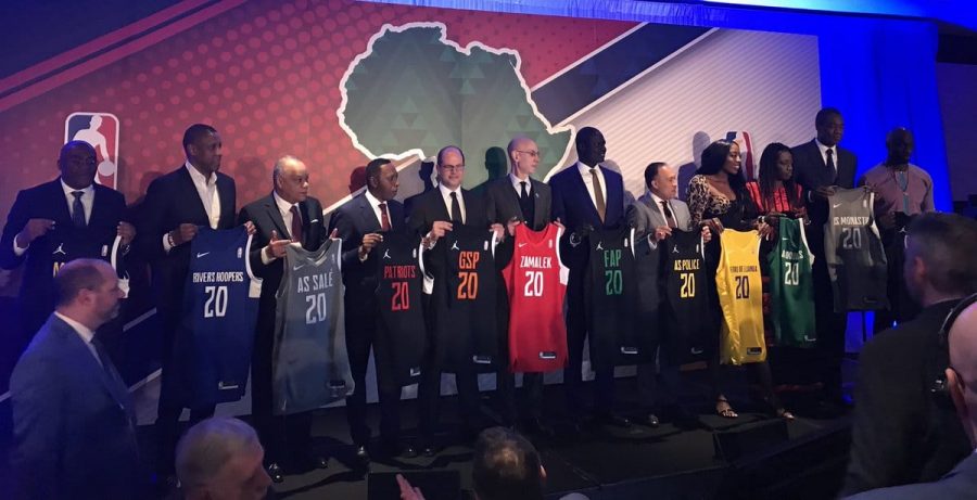 Toronto Raptors president Masai Ujiri, 2nd right, with the jersey of Nigeria’s Rivers Hoopers