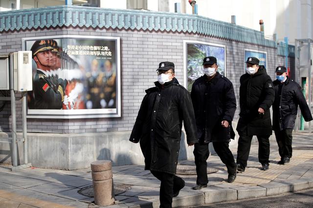 Chinese security men in Beijing
