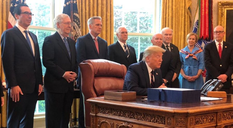 Trump at the signing of the $2.2trillion stimulus bill