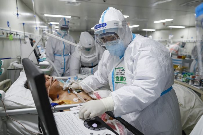 Chinese doctor examines a Coronavirus patient