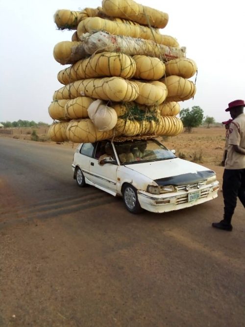 FRSC official stops a man who has turned his car into Mount Kilmanjaro