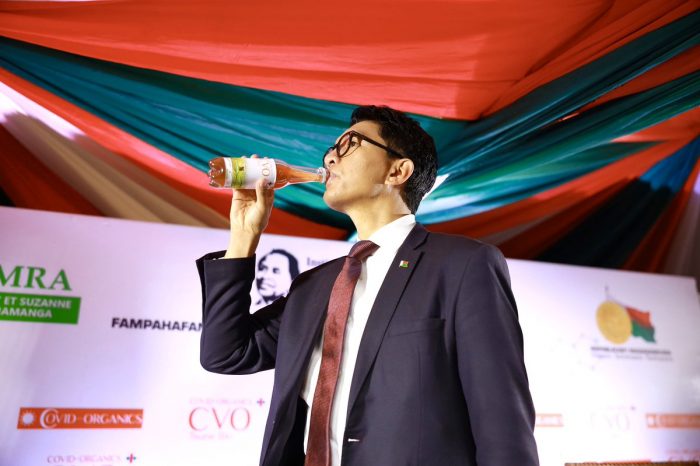 President of Madagascar Andry Rajoelina drinks an anti-coronavirus drink