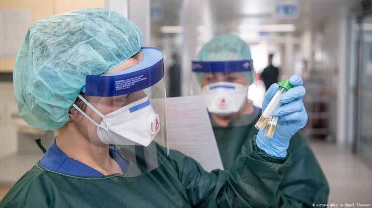 German doctors examine a coronavirus case