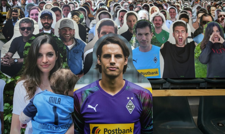 Cardboard cut-out football supporters at Borussia Moenchengladbach goalkeeper Yann Sommer was pictured seated next to his partner, Alina