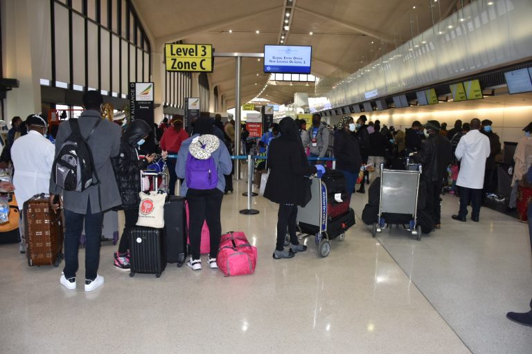 Nigerians check in at Newark Liberty International Airport in New Jersey on Saturday i
