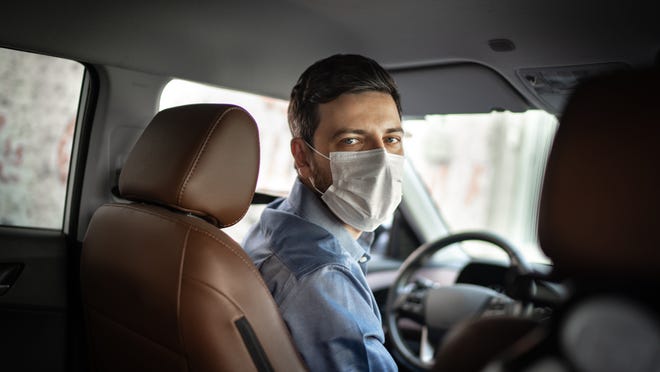 Uber driver wearing face mask
