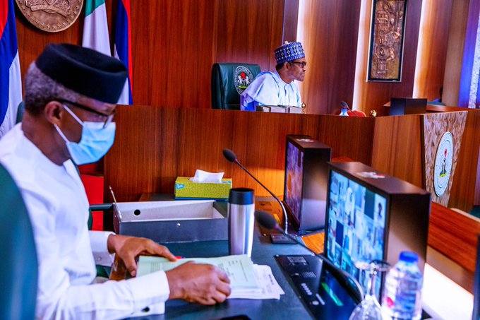 President Buhari pores over his computer as the virtual FEC Meeting holds