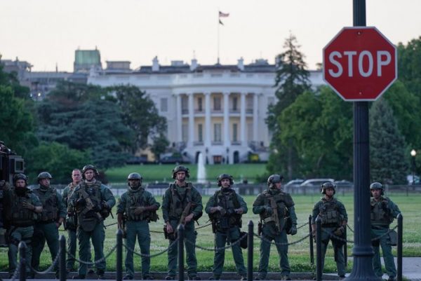 Securitymen guard the White House on Sunday