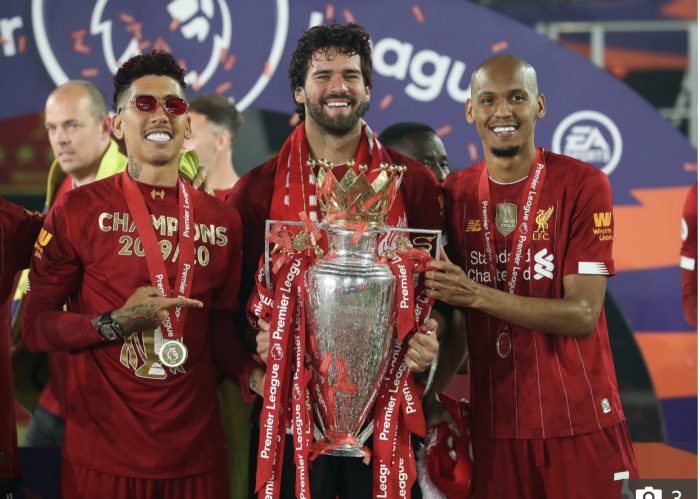 Fabinho, right with fellow Brazilians, Firmino, left and keeper Alisson