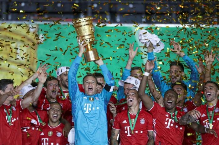 Bayern Munich captain Manuel Neuer lifts the German Cup