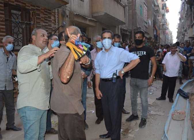 Egyptian officials at the site of the collapsed building