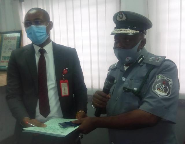 Customs official Olayinka hands over the files of the two Lebanese