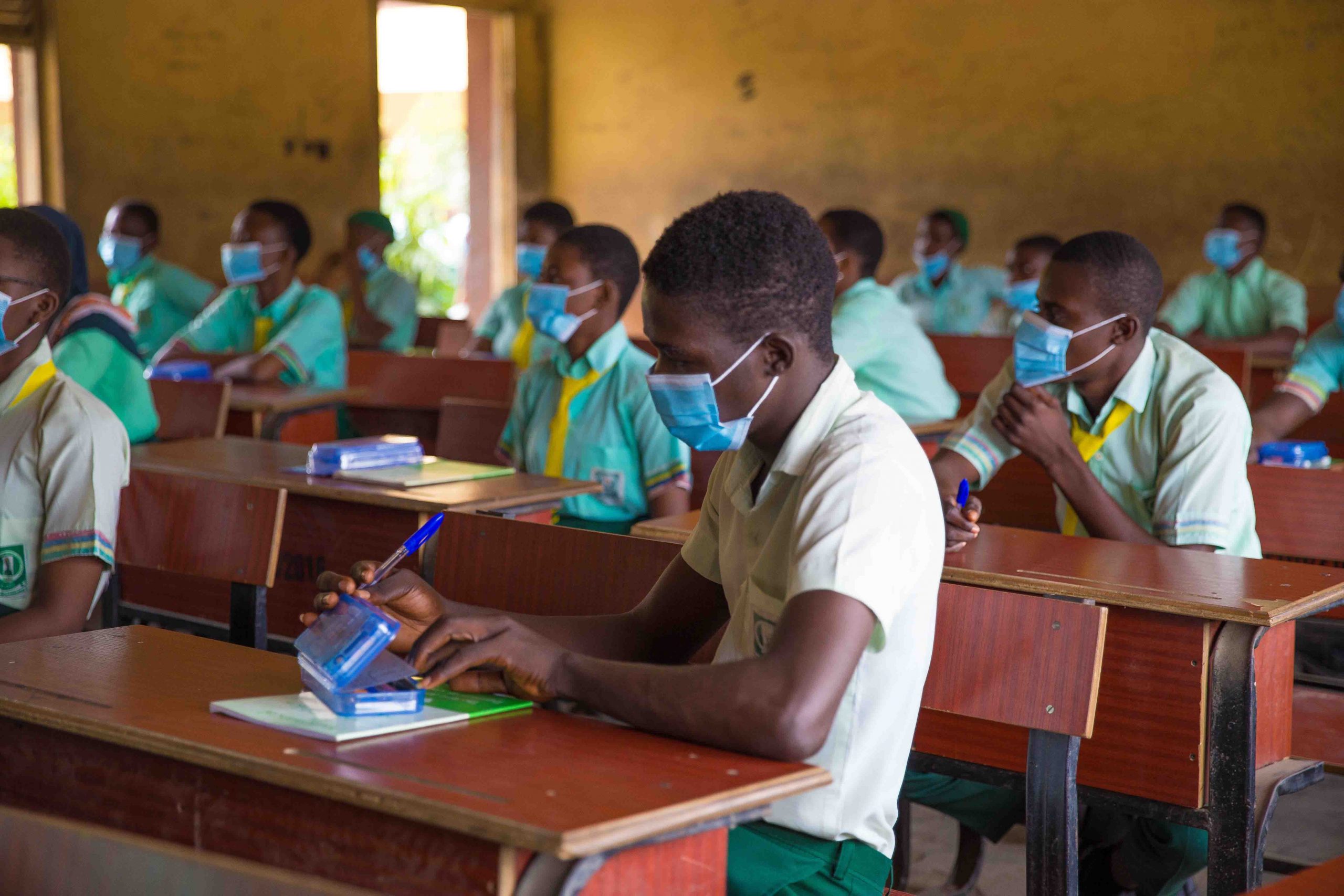 Final year students in a Lagos school wear masks and kept physical distance from each other while they wrote their WAEC exam, earlier today