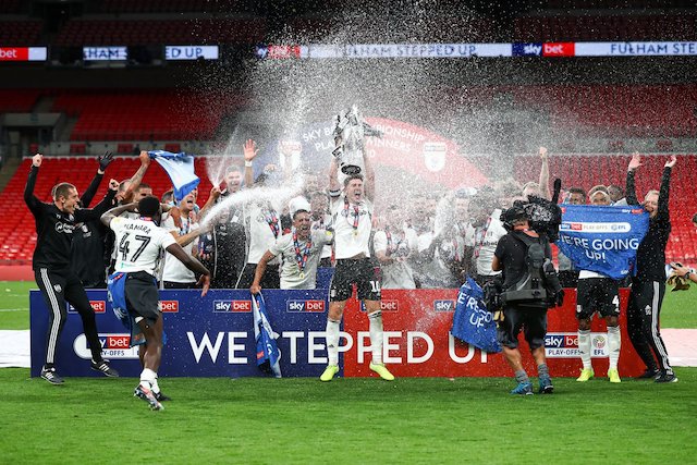 Fulham players after earning return to Premier League